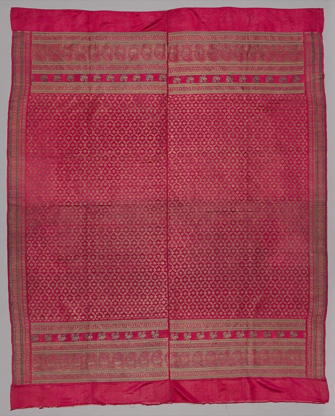 Rani pink brocade saree with gold jaal and peacock border