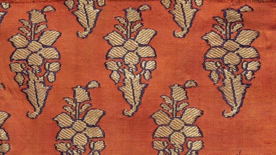 Rust orange Benares brocade with gold floral bunches