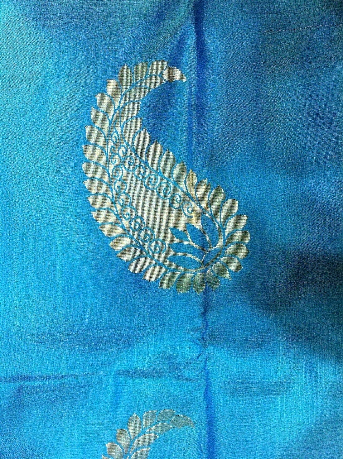Sky-blue soft silk saree with a gold paisley motif